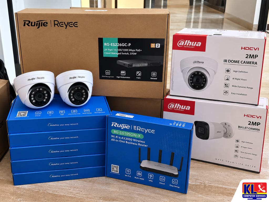 Ruijie Reyee networking equipment, business router, PoE switch, CCTV cameras, and CCTV camera packaging arranged for a professional CCTV installation and network infrastructure project in Kuala Lumpur.